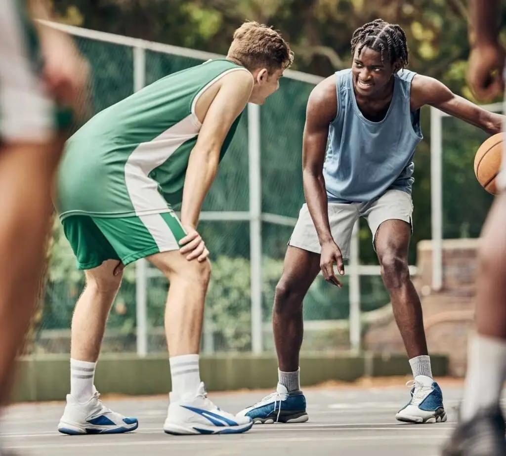 Men playing basketball | Featured Image for the Exercise and Mental Health Page by Pivotal Motion Physiotherapy